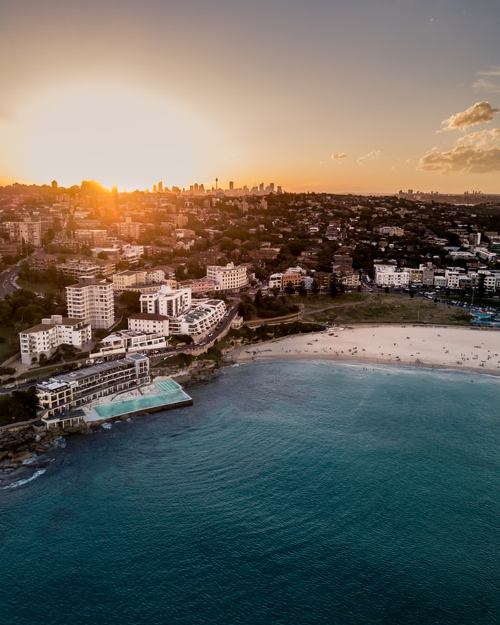bondi beach, iceberg, beach and the ocean during sunset, view over the city sydney in australia