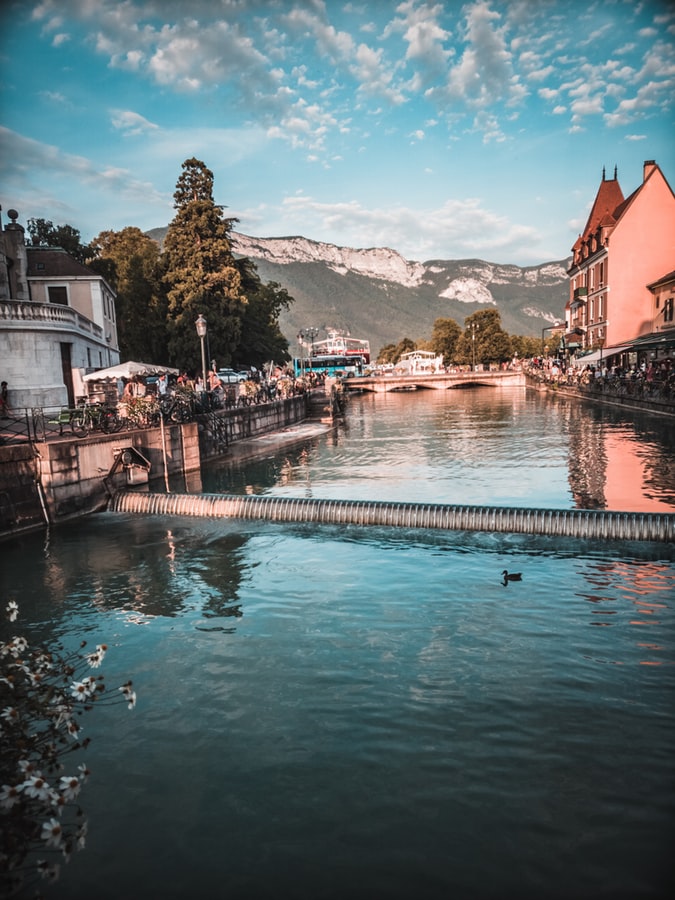 view from the river over the village annecy in france, fairy tale places