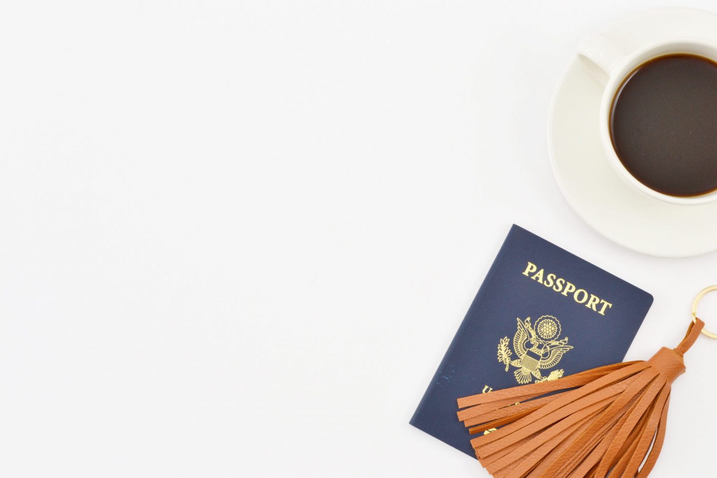 a passport with coffee flat lay photo, travel mistakes to avoid, travel documents