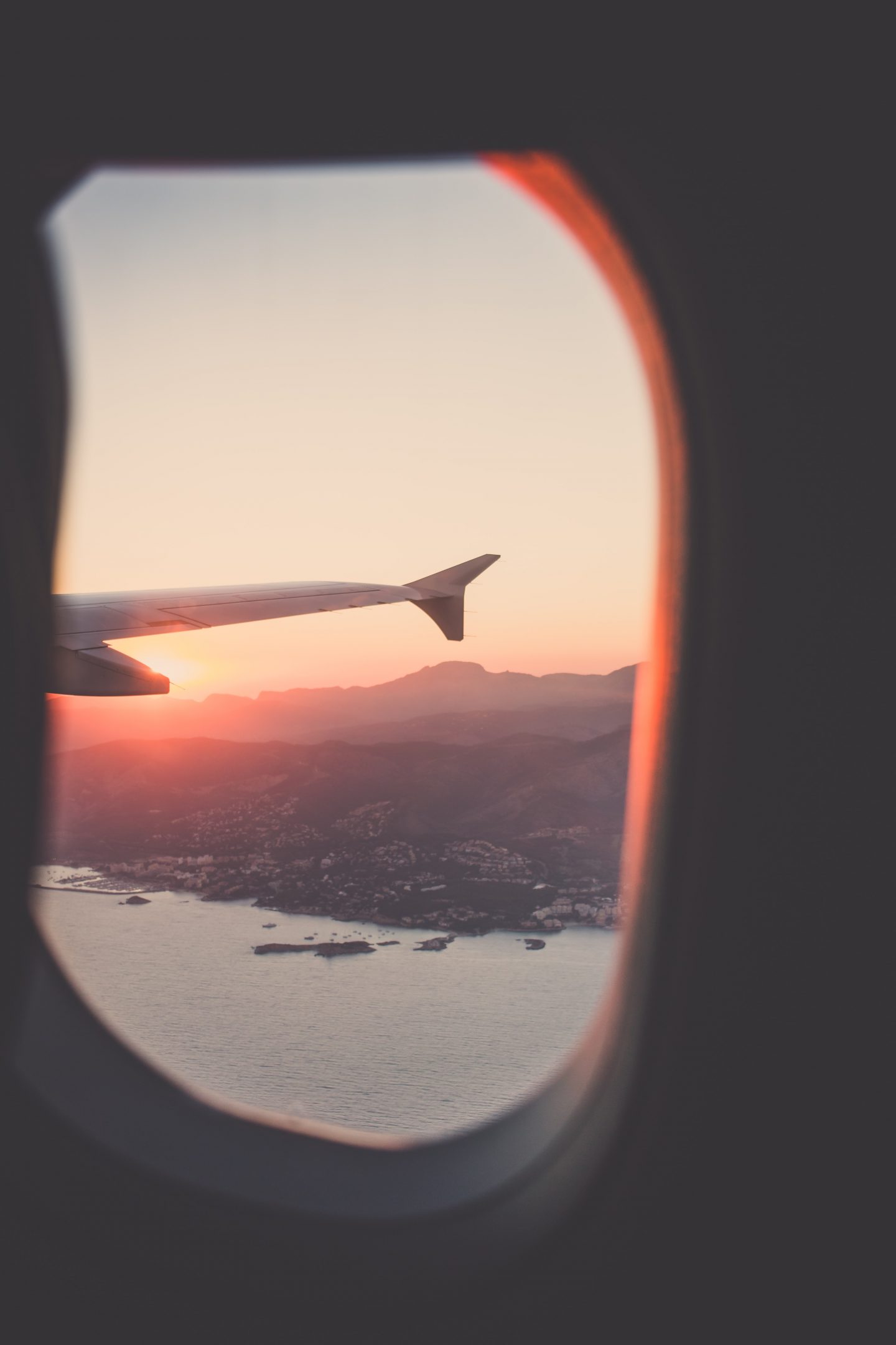 a view from the airplane over mountains, ocean view, mountain view, luxury travel