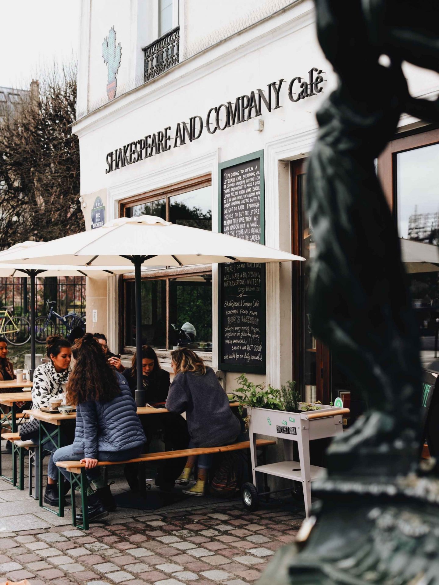 white restaurant and cafe with white umbrellas, vegan and vegetarian restaurant