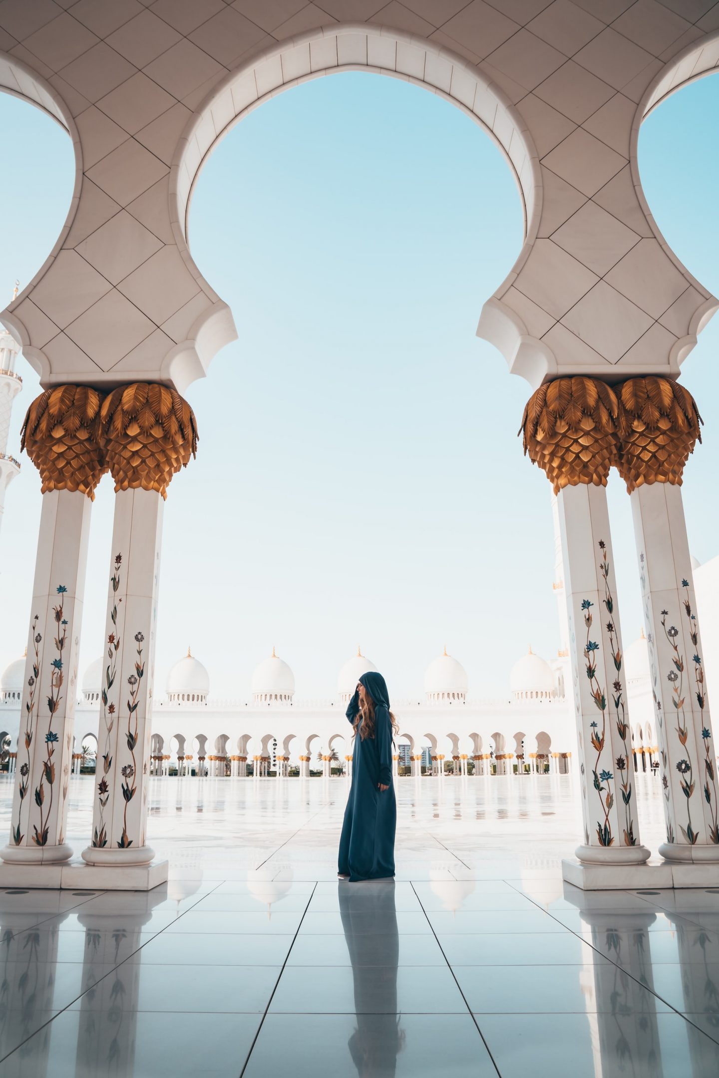 girl in a mosque, pillars, photography, architectual photography
