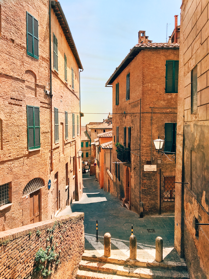sunset or sunrise over an old historic street in italy
