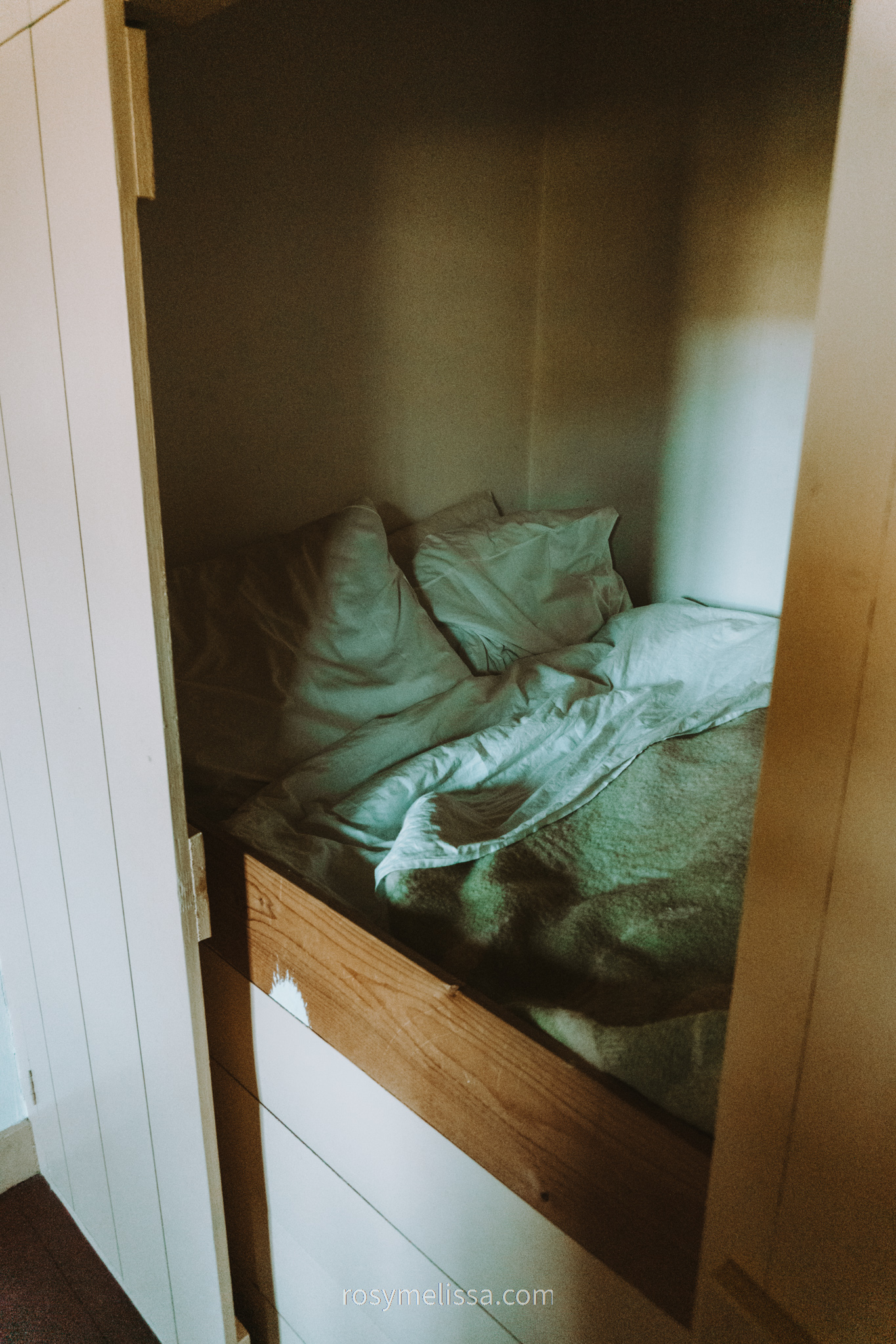 an old bed in a very old dutch home, inside view of a building in openluchtmuseum