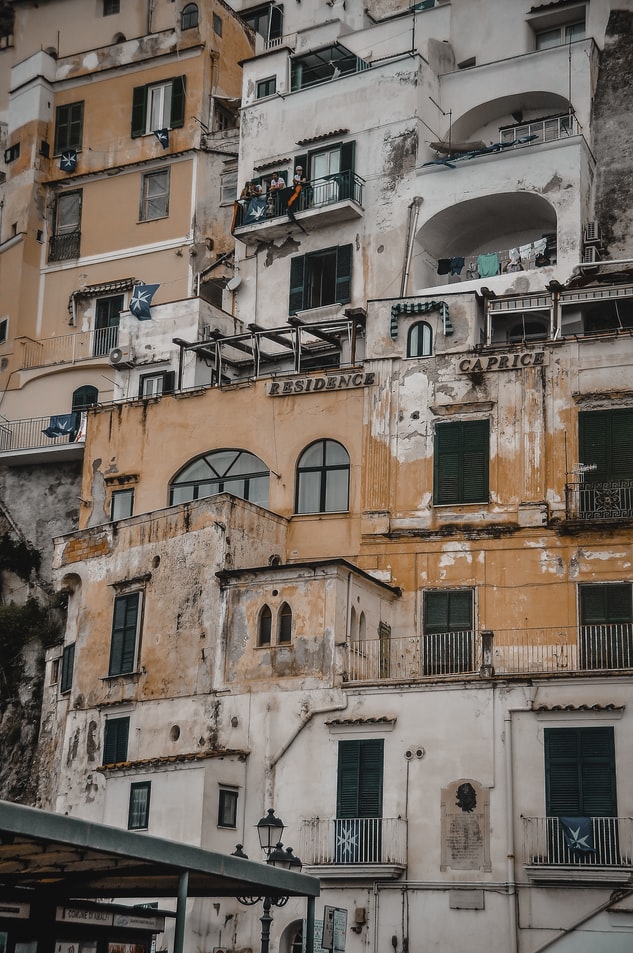 photo of a old and pastel colored building in italy